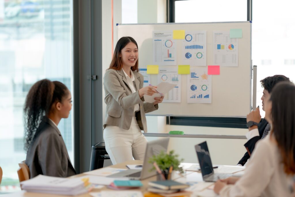 A young business professional taking charge of the team meeting.