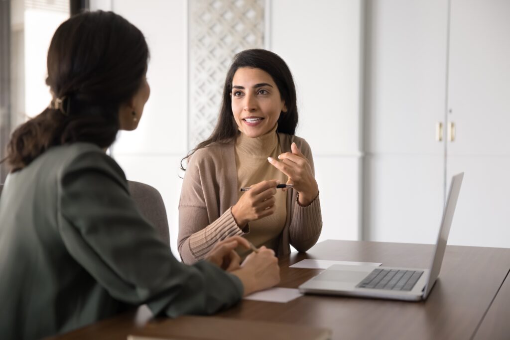 A business professional having a positive discussion with her client.